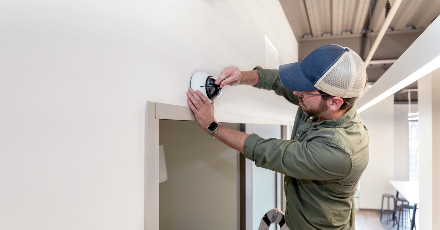 Dome camera being installed to a ceiling