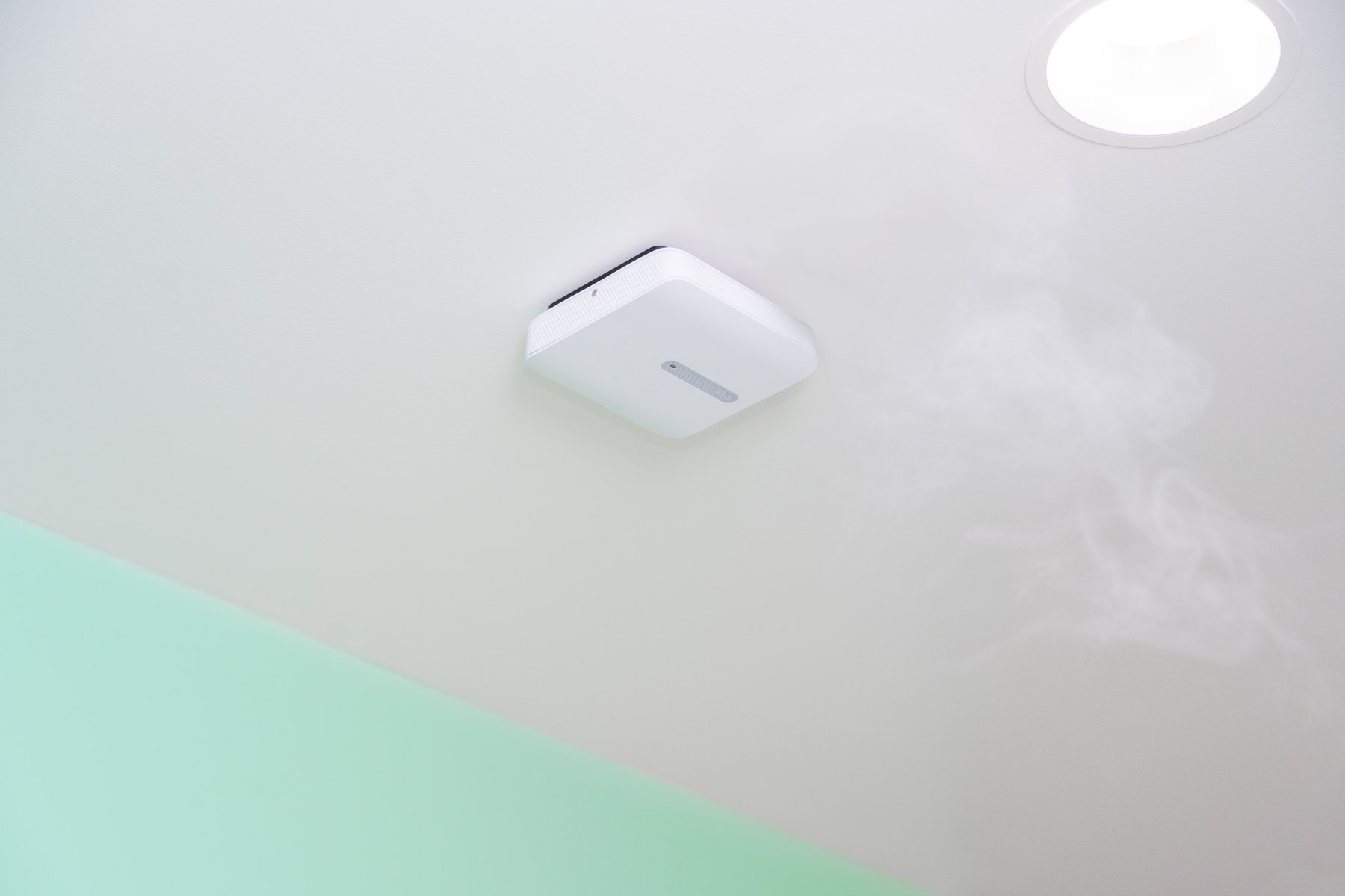 A Verkada SV23 sensor on a ceiling as vapour drifts past